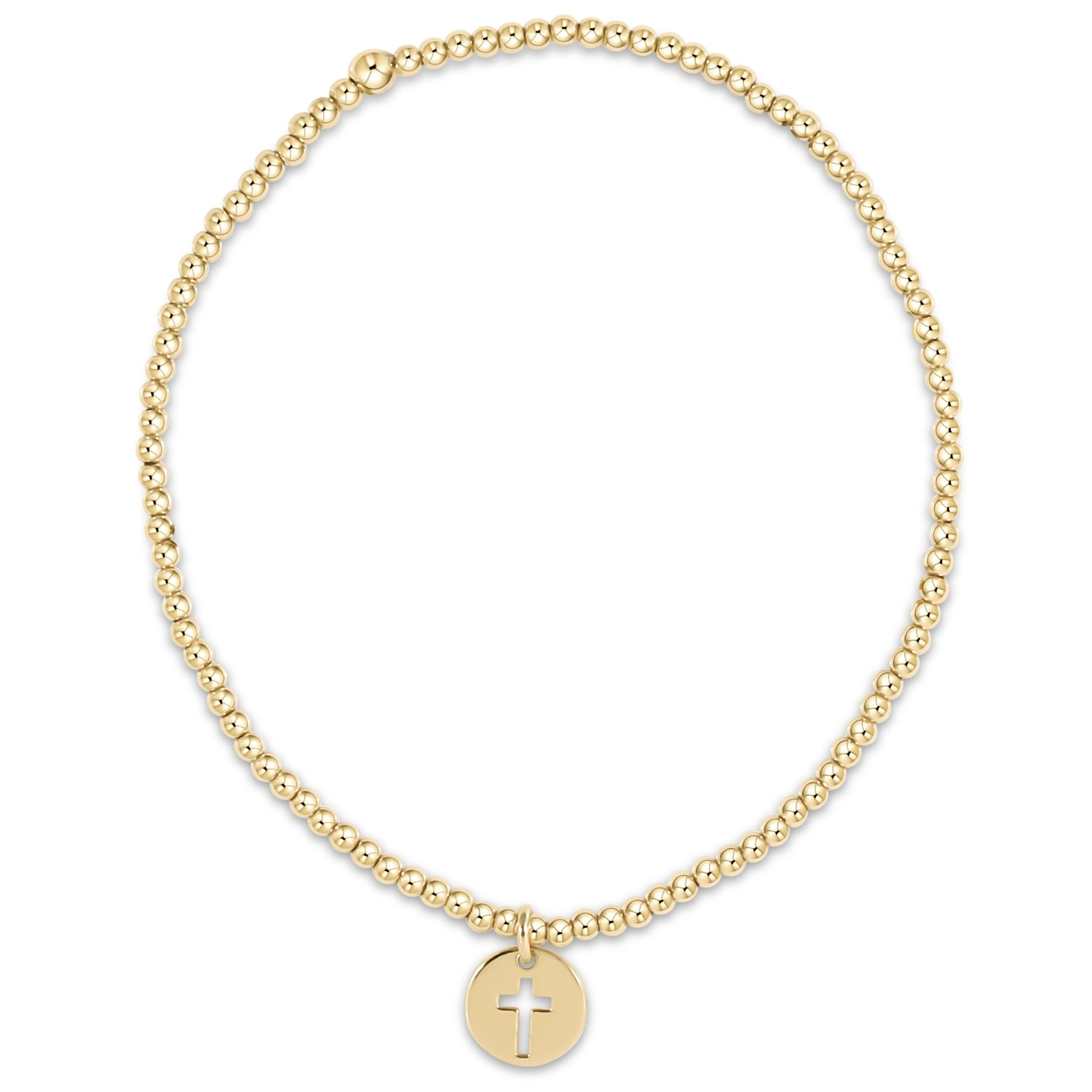 Classic gold 2mm beaded stretch bracelet with a small round disc charm featuring a cross cutout.