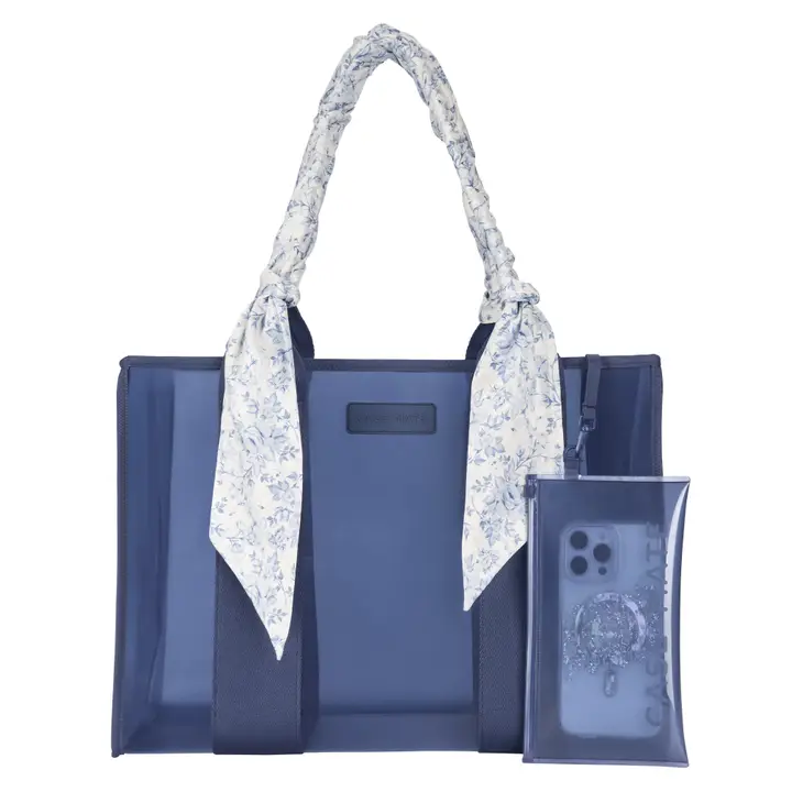 Blue jelly tote bag with floral bow-wrapped handles and a matching clear phone pouch.