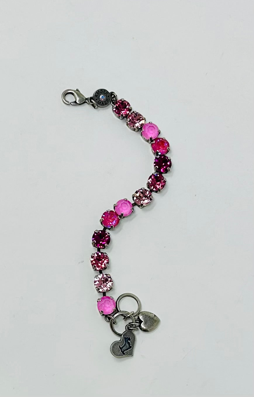 Milan classic bracelet featuring pink crystal stones and two silver heart charms.