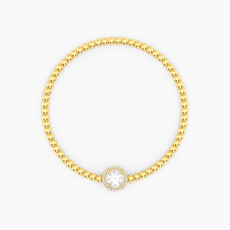 Gold-plated beaded bracelet with a round-cut center gemstone and diamond halo.