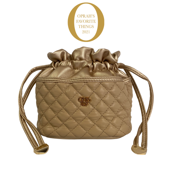 Vegan leather jewelry case with suede interior holding ten clear removable pouches.