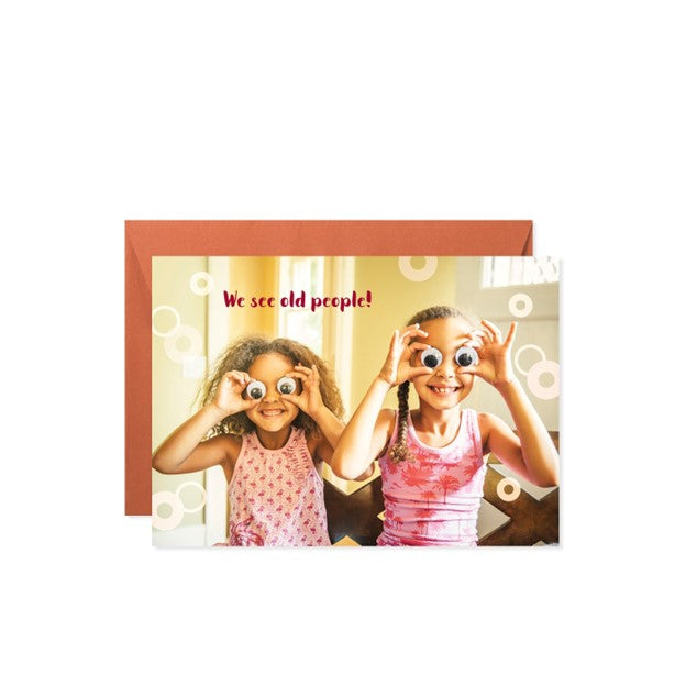 Birthday greeting card featuring a cartoon illustration of two elderly people with the text We see old people on front.