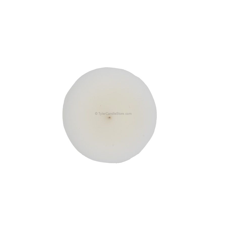 Top view of a round, white 2oz Tyler votive candle with a centered wick.