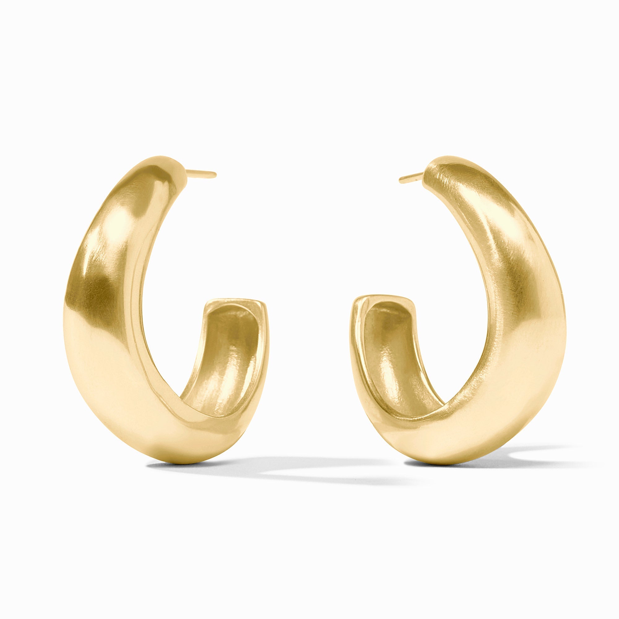 Curvaceous golden Wave Hoop earrings with open interiors in medium size.