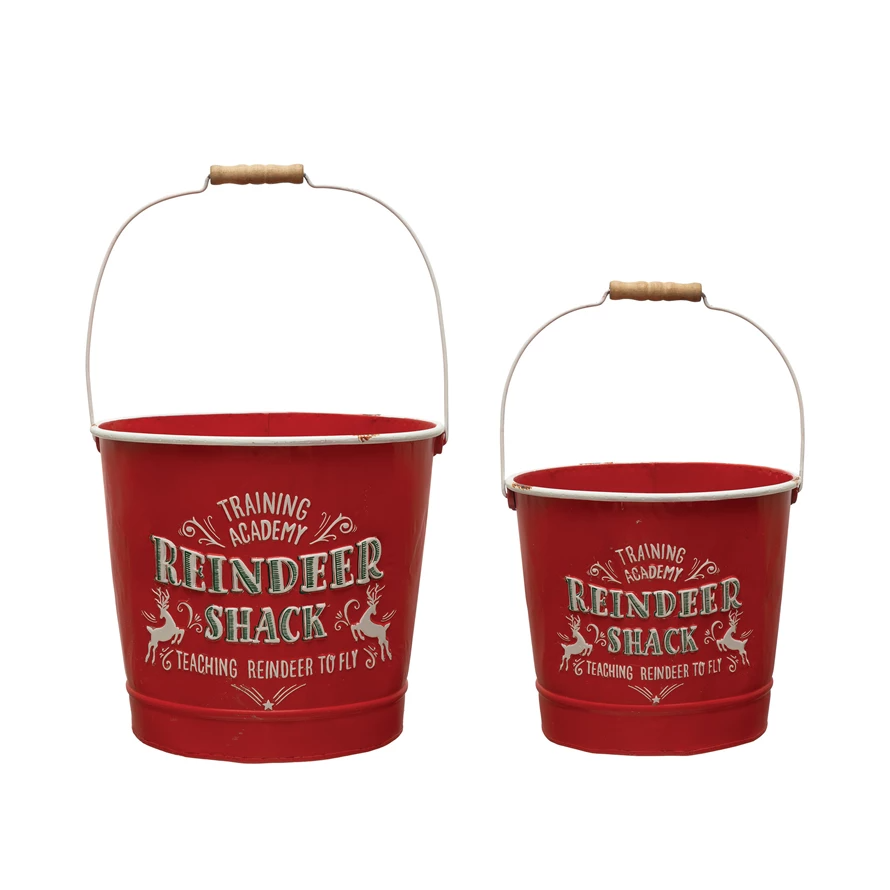 Metal bucket with reindeer shack design featuring iron construction.