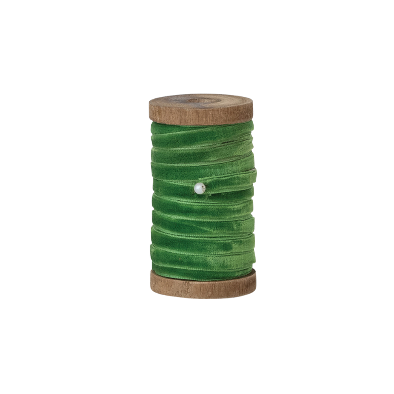 10 yards of 1/4 inch wide green velvet ribbon wrapped around a vintage-style wooden spool.