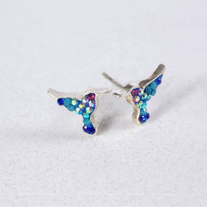 Sterling silver hummingbird post earrings featuring Austrian crystals in a detailed bird silhouette.