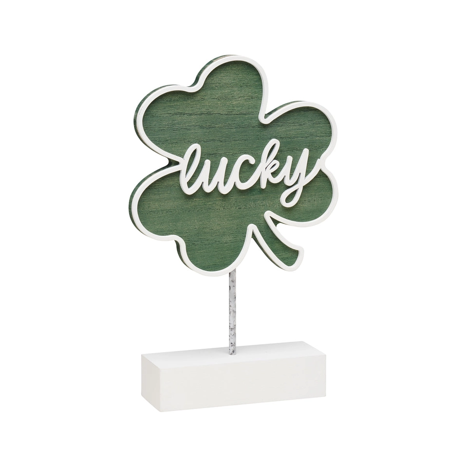 Green washed wood shamrock cutout with white painted laser border on a base