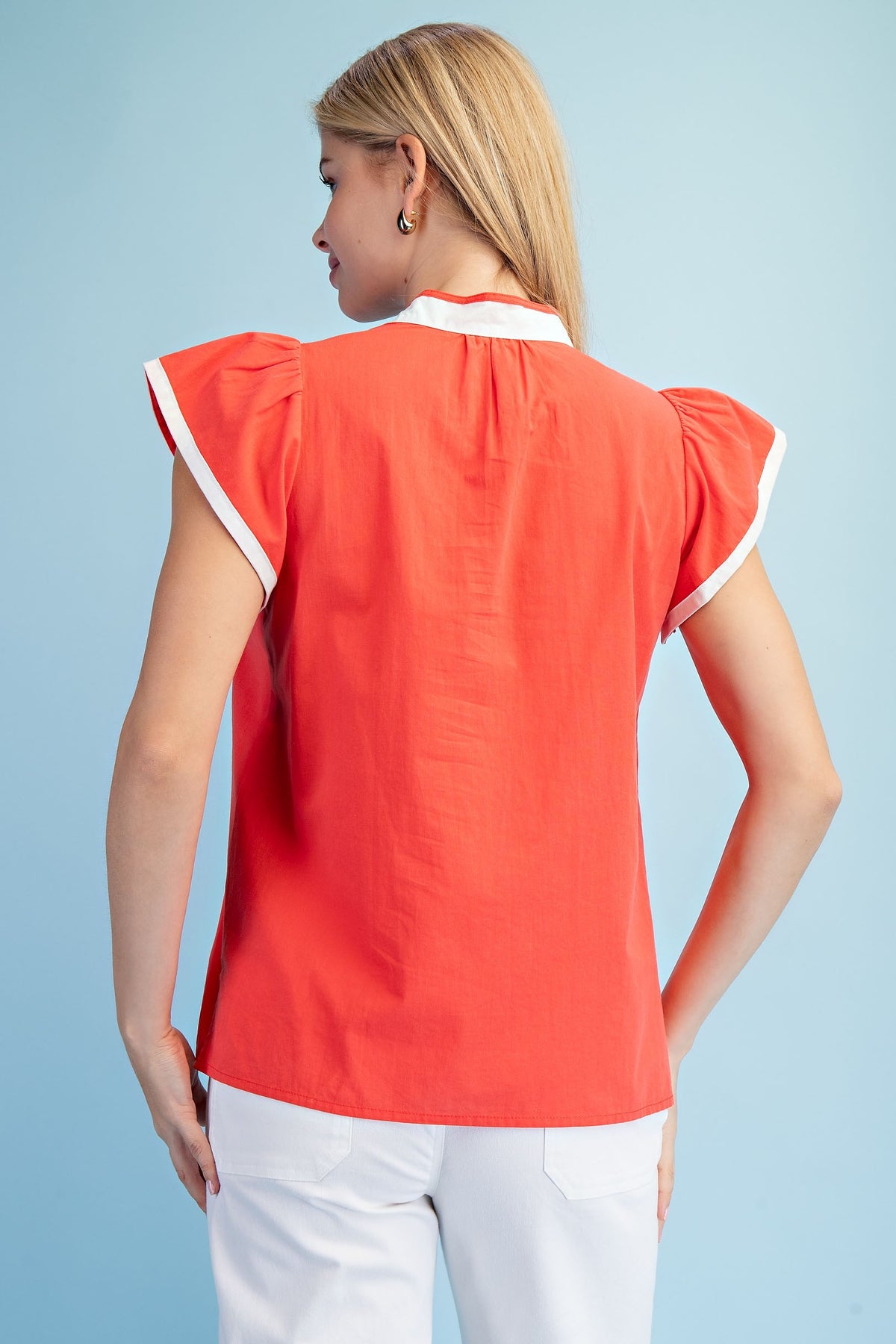 Floral embroidered V-neck cotton top with contrasting stripe trim and flutter sleeves.