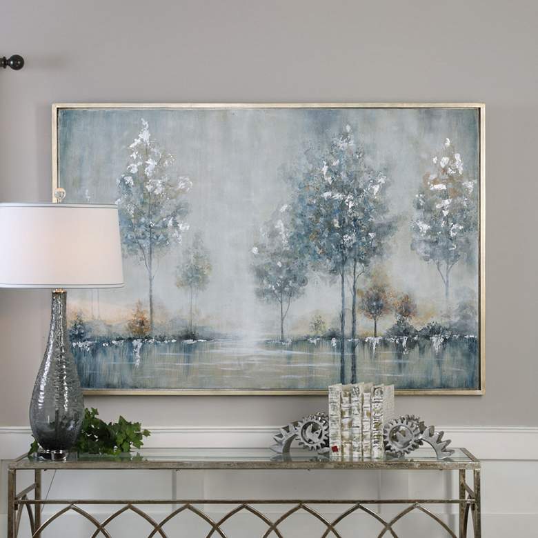 Abstract landscape painting of trees reflected in water with a silver frame.