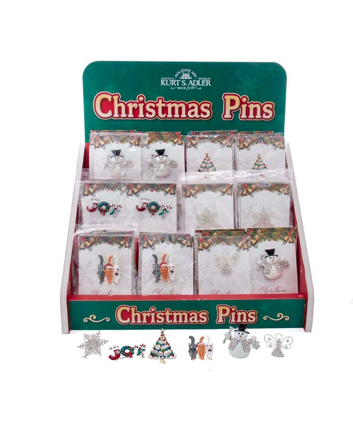Metal Christmas pin with stone and enamel accents in a festive holiday shape.