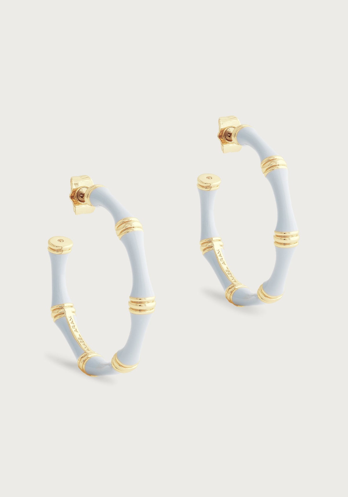 Light blue hand-painted enamel bamboo-style hoop earrings in 18K gold-plated brass.