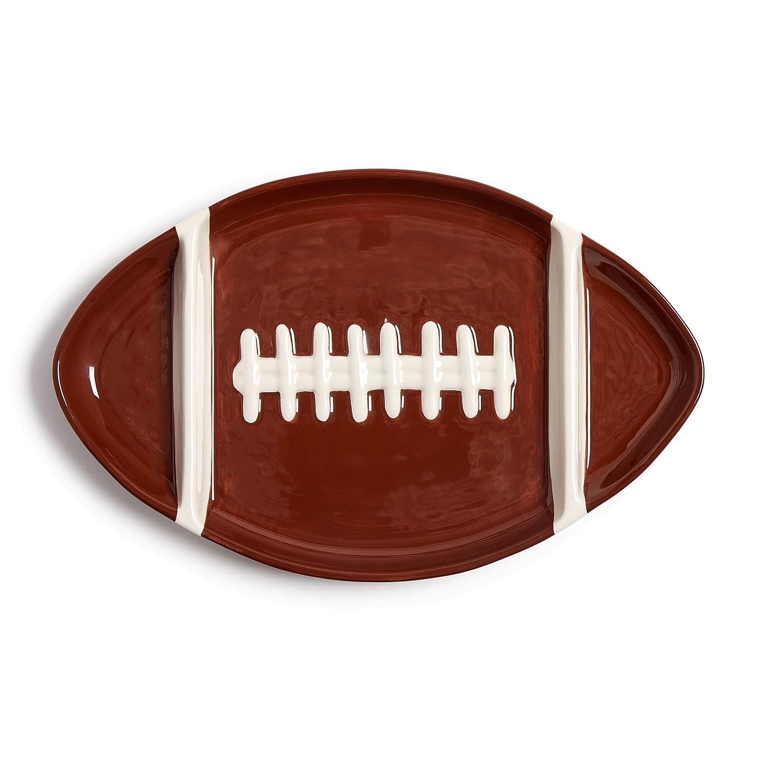 Football-shaped ceramic sectional serving platter in brown with white laces and stripes.