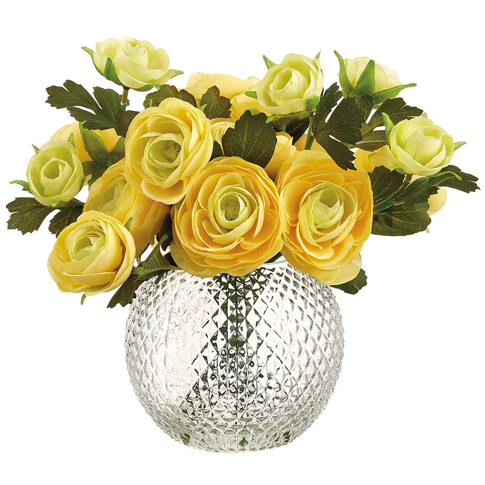 Yellow ranunculus in a clear glass vase with iron wire support