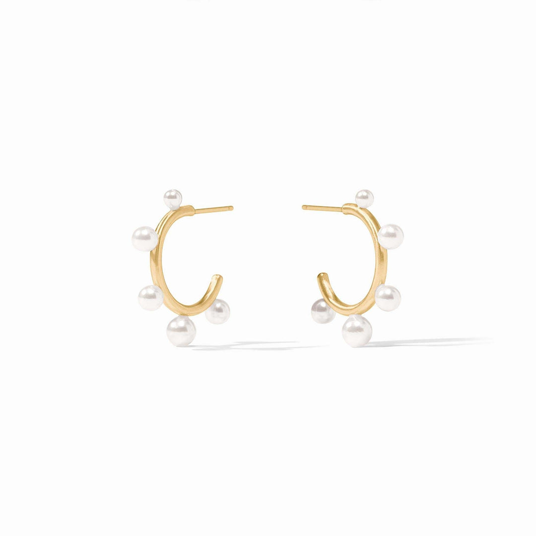 Slender golden hoop earring studded with small shell pearl gemstones