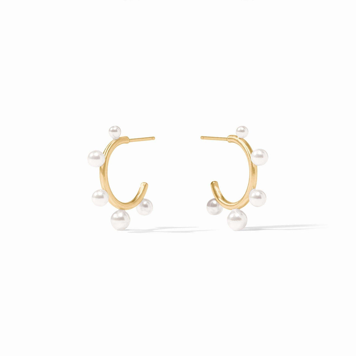 Slender golden hoop earring studded with small shell pearl gemstones