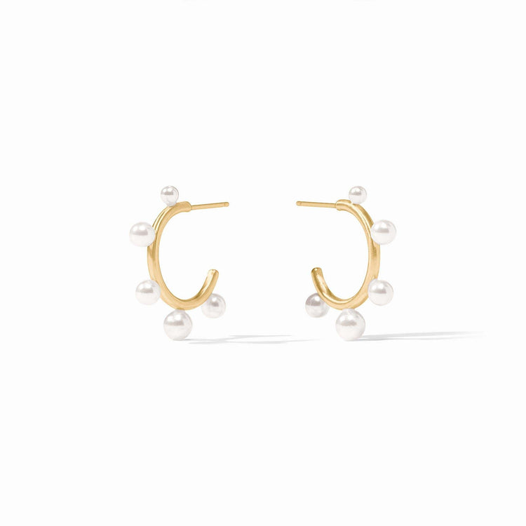 Slender golden hoop earring studded with small shell pearl gemstones