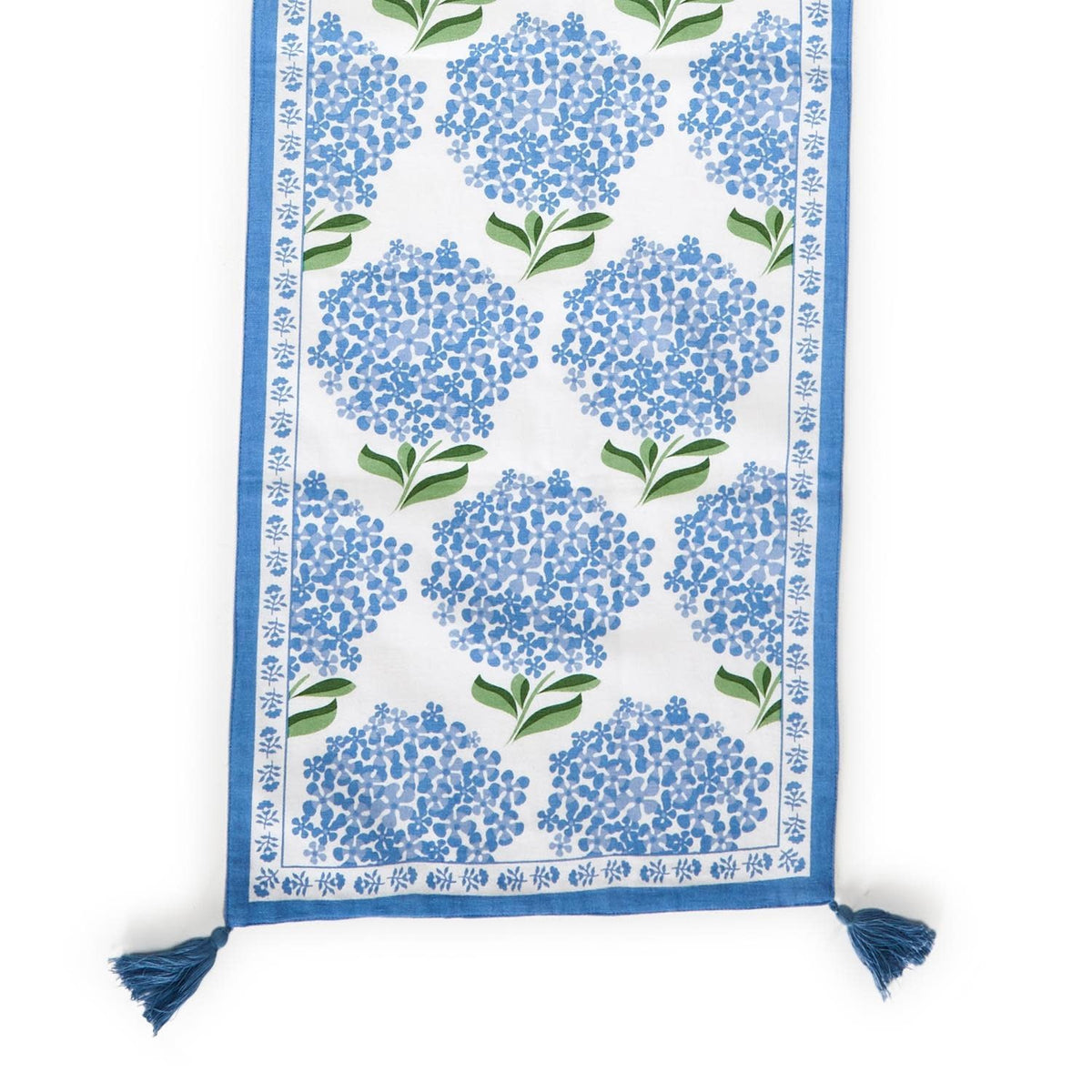 Cotton table runner with blue hydrangea floral pattern on white background