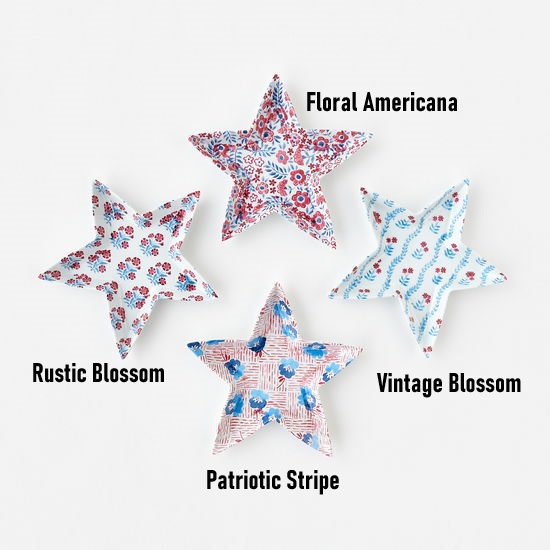 Four 8-inch melamine star plates in Floral Americana, Rustic, Vintage, and Patriotic patterns.