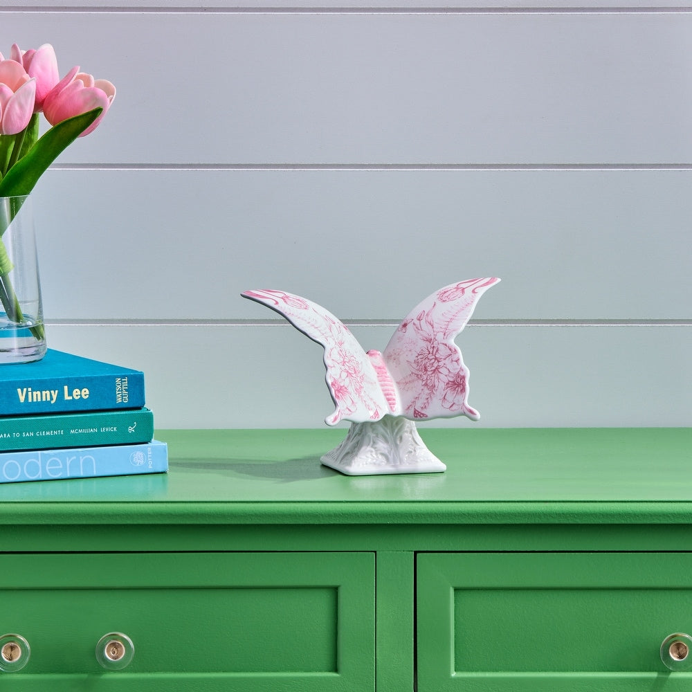 Natural dolomite ceramic butterfly figurine with intricate detailing on a sleek pedestal base in neutral tones.