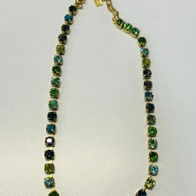 Antique gold plated Sarina necklace with green mixed crystals on a brass base