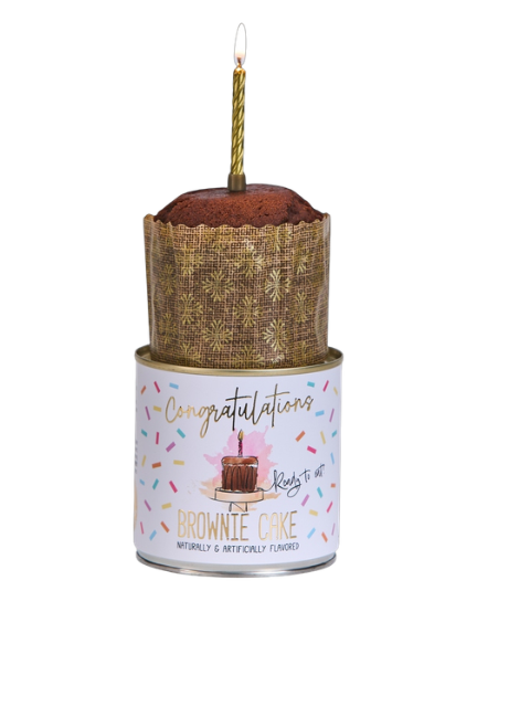 Cancake brownie cake in a tin with a lit gold candle on top and a Congratulations label.