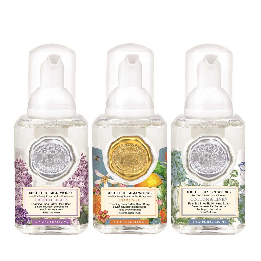 Set of three mini foaming soap dispensers in complementary scents with distinct designs.