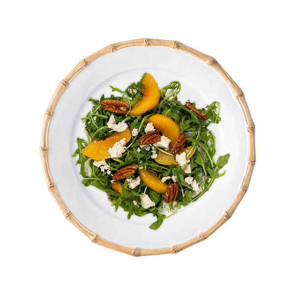 Classic Bamboo Natural ceramic salad plate with a bamboo-style rim, featuring a fresh peach salad.