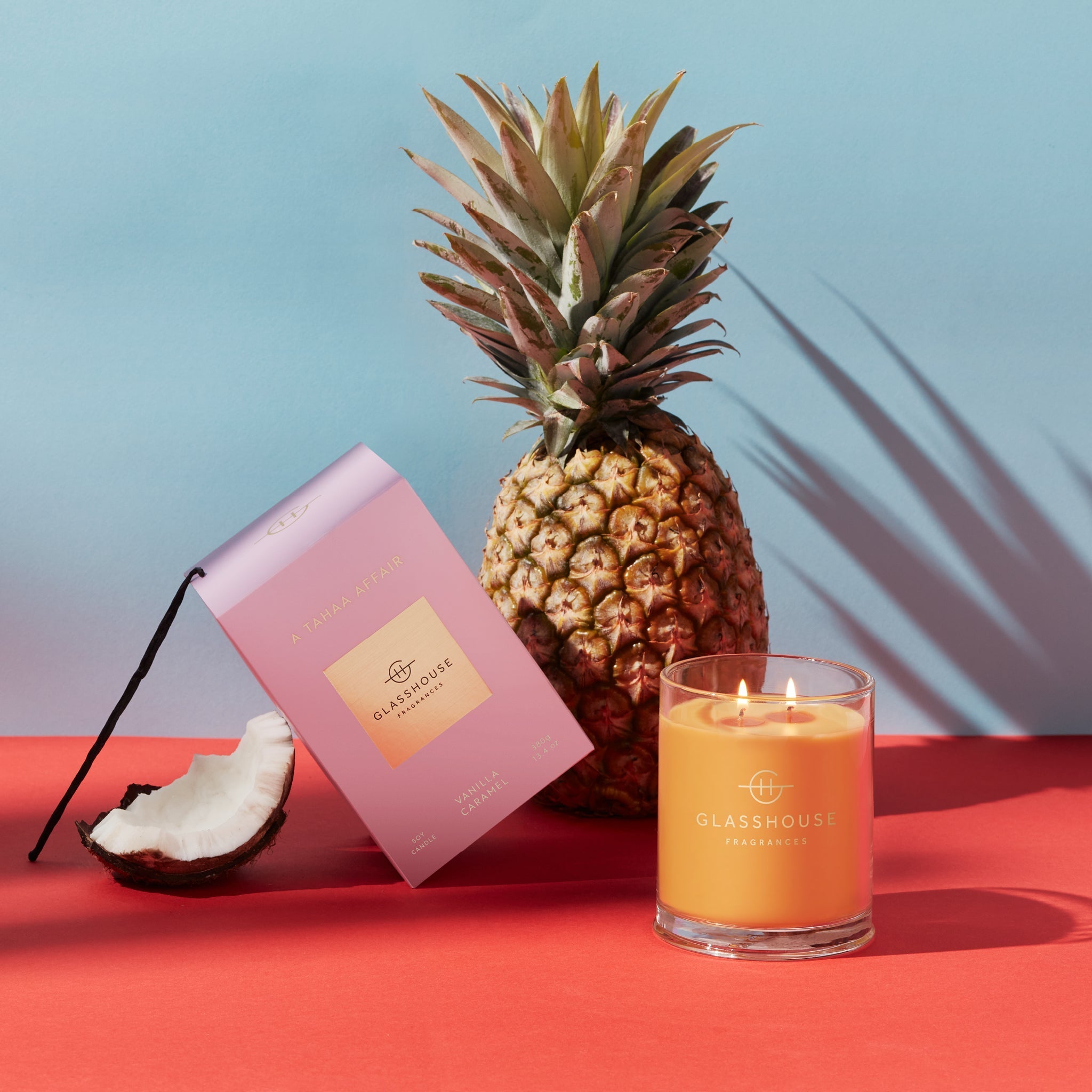 A Tahaa Affair candle in a clear glass jar with white soy wax blend and natural cotton wick.