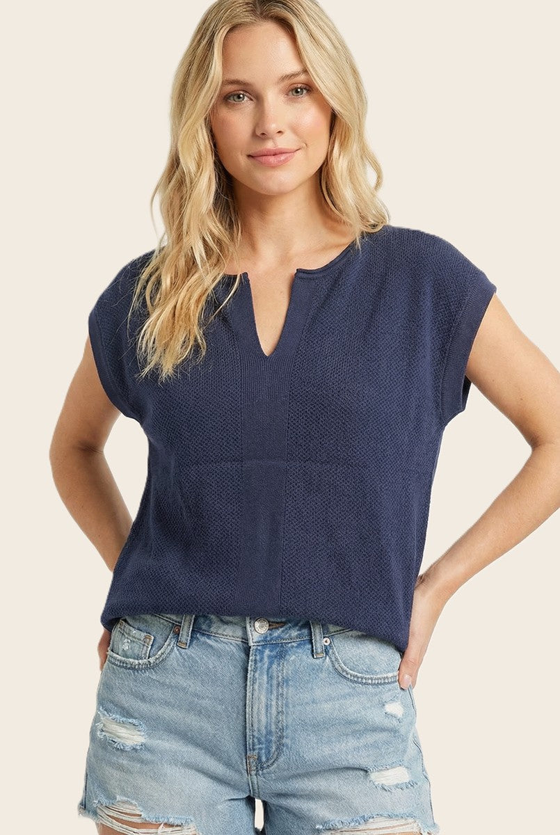 Isabelle Pointelle short sleeve sweater top in white with a slit neck detail.
