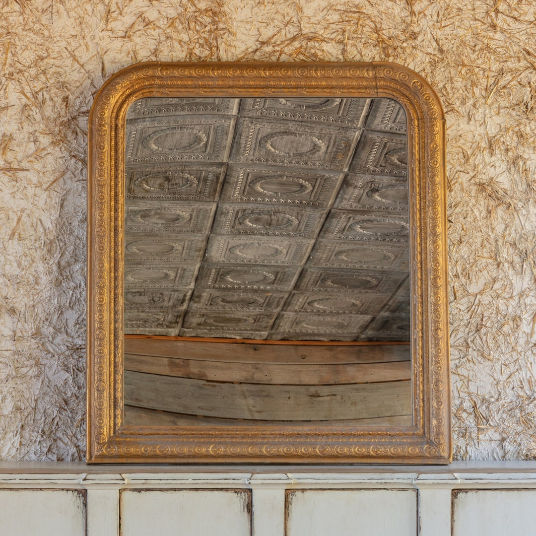 Vertical aged gold metal mirror with wood backing