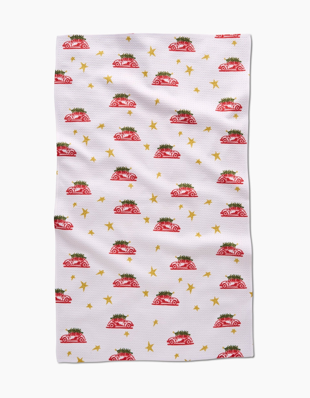 Holiday tea towel with waffle weave construction in red featuring a festive snowflake pattern.