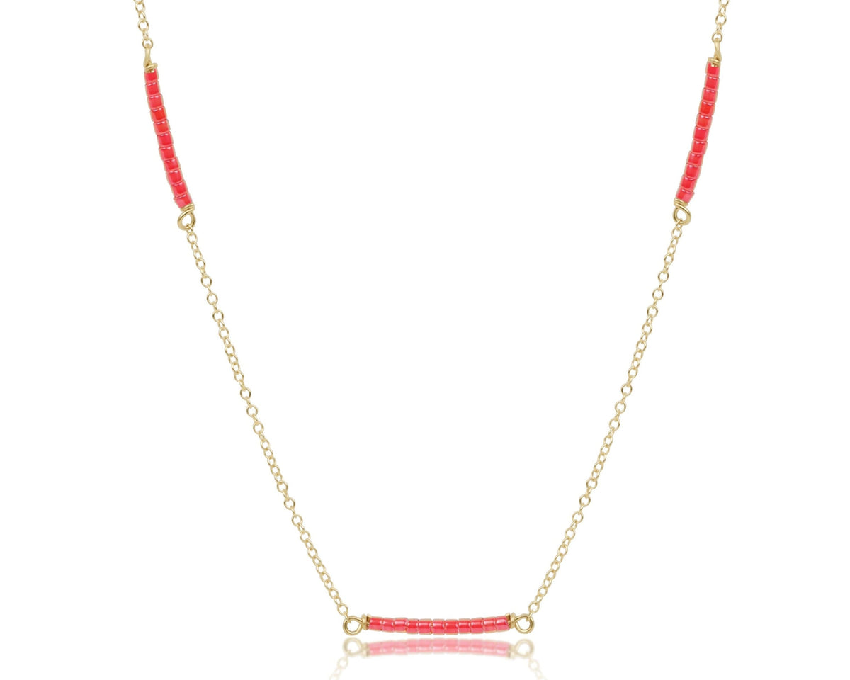 15 inch gold-filled choker necklace with three sections of red seed beads.