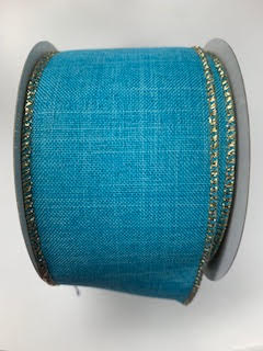 2.5 inch wide teal faux linen ribbon with gold glitter wired edges on a spool.
