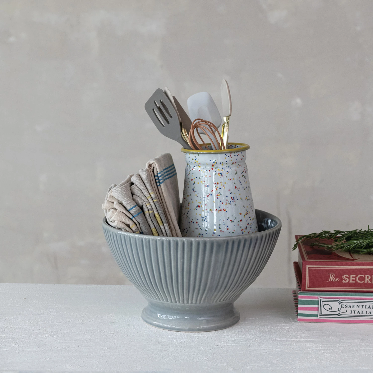 Stoneware fluted serving bowl with reactive glaze in a round silhouette.