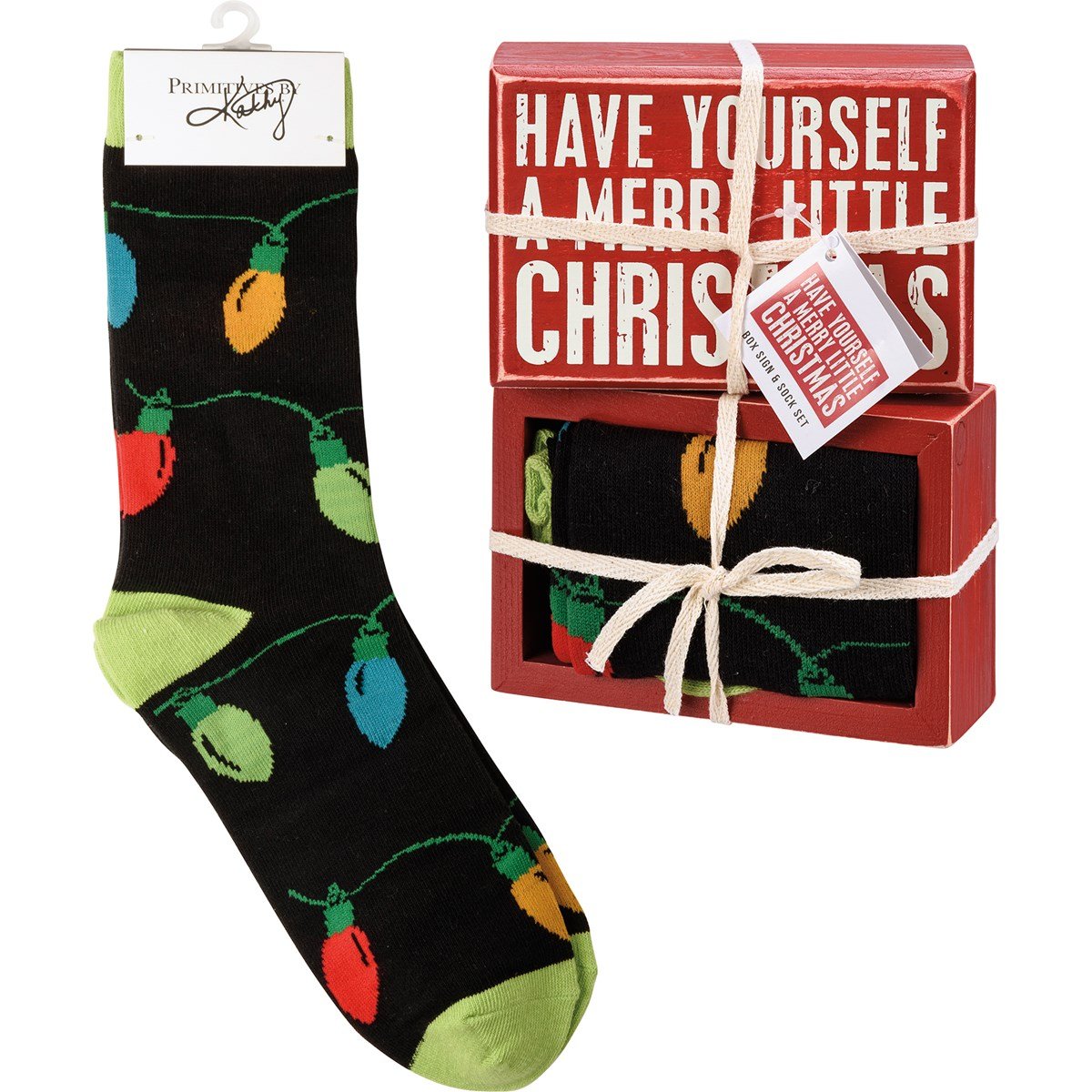 Wooden box sign reading HAVE YOURSELF A MERRY LITTLE CHRISTMAS with matching cotton socks.