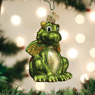 Little Dragon ornament in green resin with gold accents on a white background.
