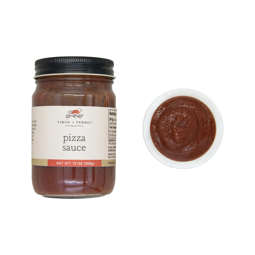Open jar of red pizza sauce with a white lid