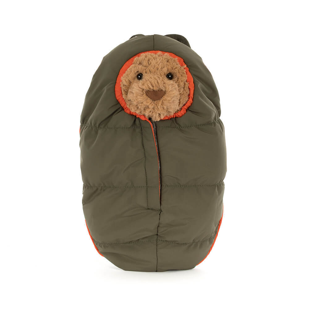 Bartholomew Bear in a green and orange quilted sleeping bag hiking outfit.