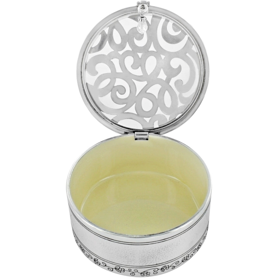 Open Skribbel round silver trinket box with a hammered finish and decorative cutout lid.