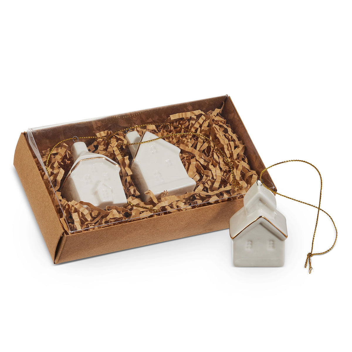 Set of three white ceramic house ornaments with gold trim in a kraft gift box with paper filler.
