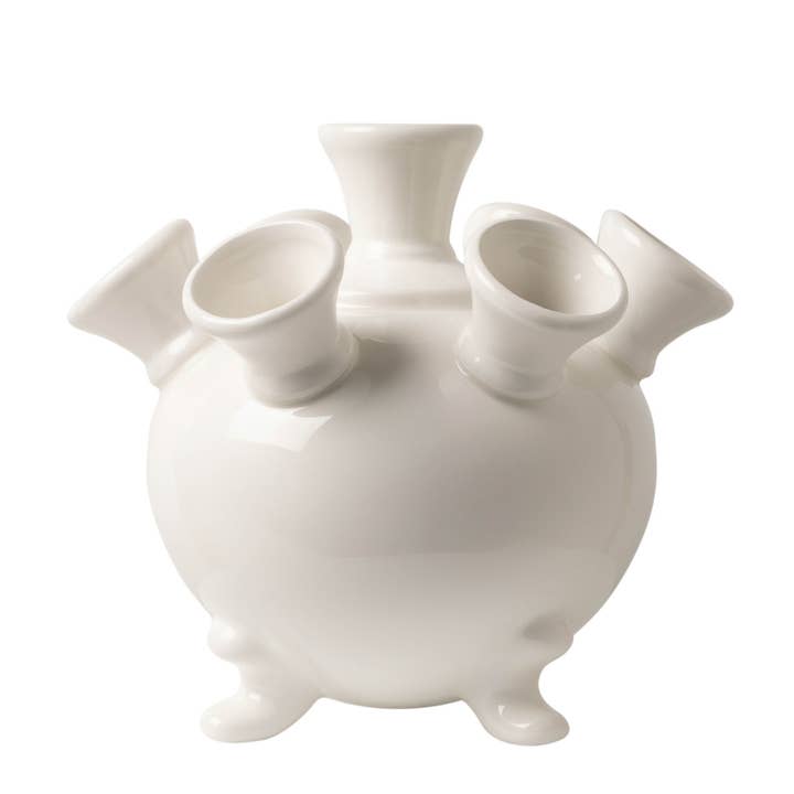White ceramic tulip vase on slender legs with a smooth glossy finish.