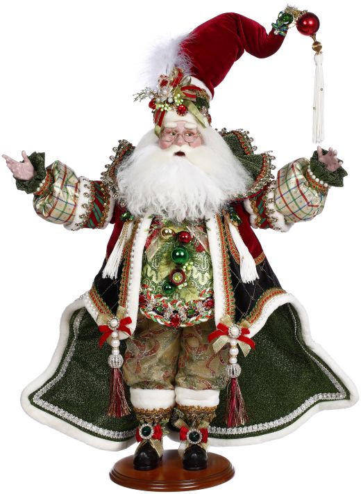 A detailed Santa figure decorating a tree with red accents.