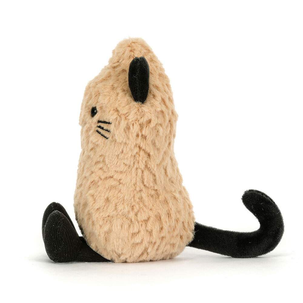 Small plush peanut-shaped cat with tan textured fur, black ears, tail, and feet.