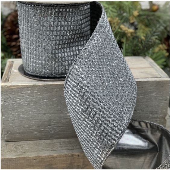 4 inch wide silver and gold metallic mesh ribbon on a spool, displayed on a rustic wooden box.