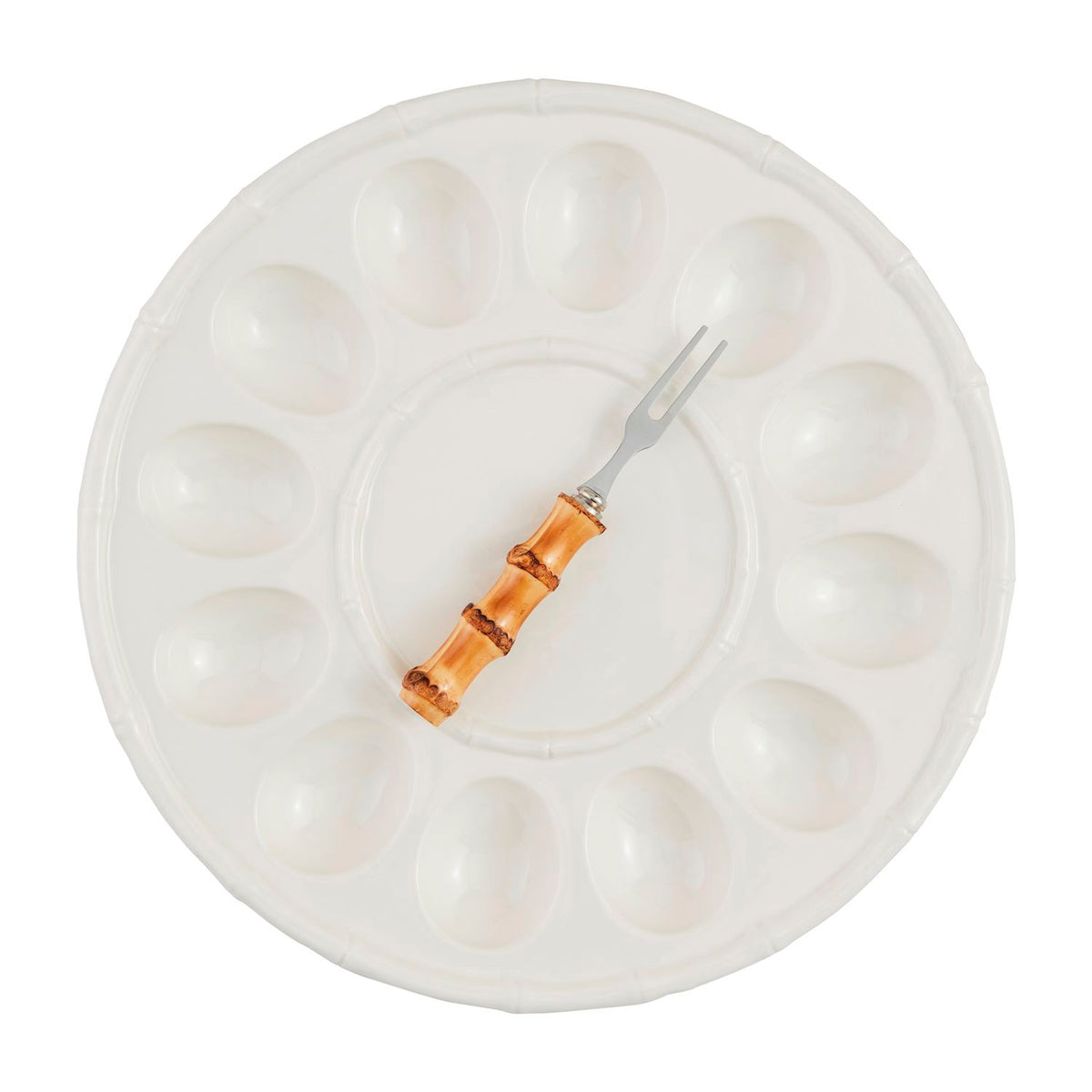 White stoneware deviled egg tray set with a circular shape.