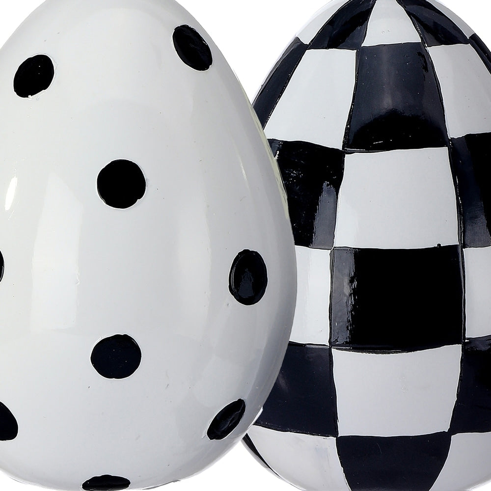 Hand-painted resin Easter egg with festive colors on a white background.
