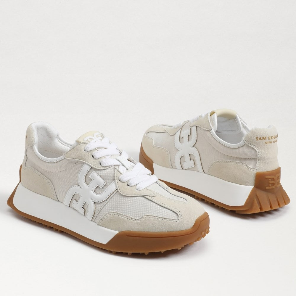 Langley lace-up sneaker in custom-dyed leather with fabric accents, rounded toe silhouette.