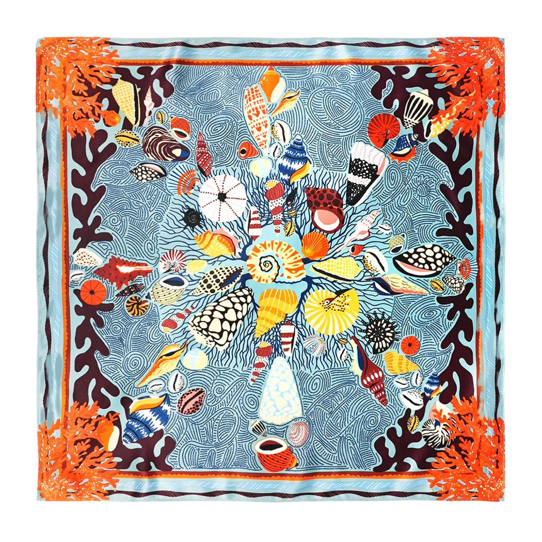Mini square scarf with a colorful seashell and coral reef design on a blue patterned background.