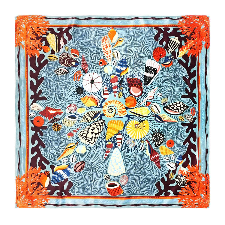 Mini square scarf with a colorful seashell and coral reef design on a blue patterned background.